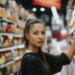 Woman browsing in supermarket aisle